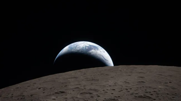 Crescent Earth rising above the cratered lunar surface, photographed by the Artemis 2 crew from deep space,